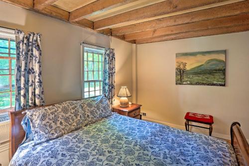 a bedroom with a bed and a window at Charlemont Retreat on Chickley River with EV Charger in Charlemont