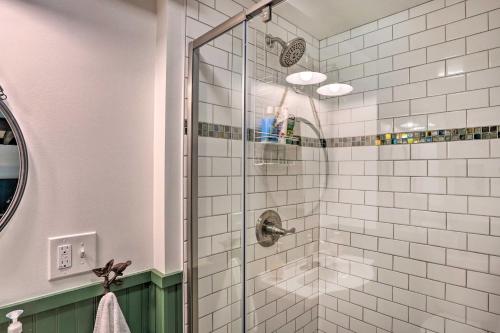 a bathroom with a shower with white tiles at Charlemont Retreat on Chickley River with EV Charger in Charlemont