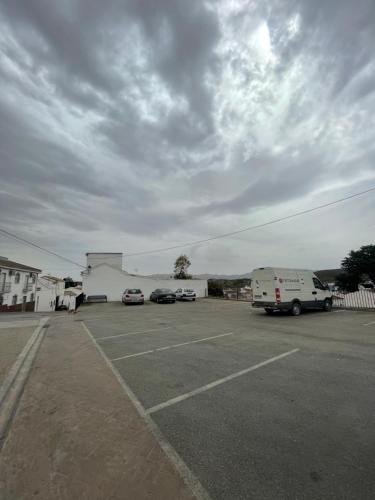 a parking lot with a van parked in front of a building at LaFrenchTouch - Escapada rural en una coqueta casa in Villanueva de Tapia