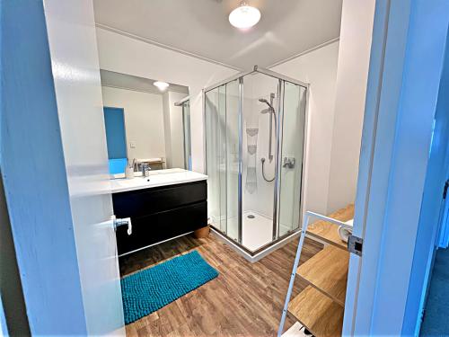 a bathroom with a shower and a sink at Magic mountain Vista in Queenstown