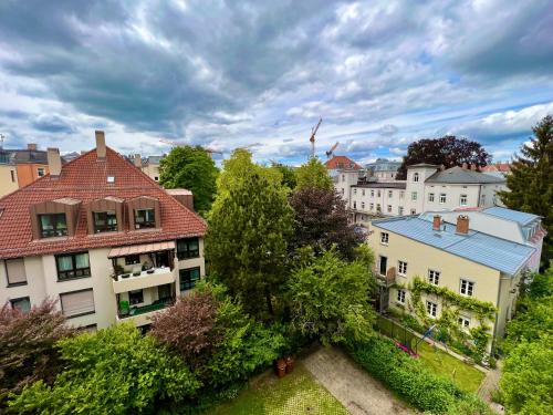 an overhead view of a city with buildings and trees at Apartment Skyline by Aux Property in Augsburg