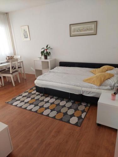 a bedroom with a bed and a rug at Apartman Perica in Zagreb