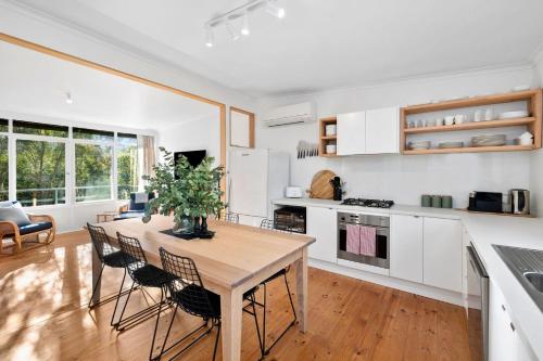 a kitchen and dining room with a table and chairs at Anglesea Beach House 2 in Anglesea