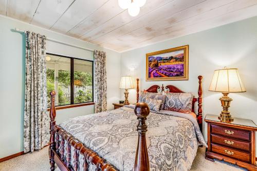 a bedroom with a bed and a window at Mendocino Dunes - Distant Shores in Fort Bragg