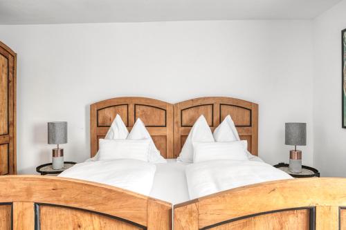 Cama o camas de una habitación en Ferienwohnung Kastenmühle im Mondseeland