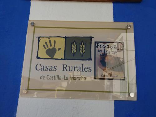 a glass window of a casas rucales sign at Casa Rural POSADA DEL JUCAR in La Gila