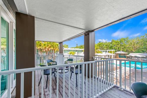 a balcony with a view of the pool at Casey Key Resorts - Mainland in Osprey