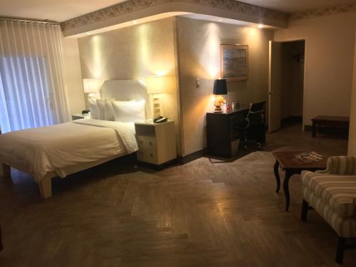 Postel nebo postele na pokoji v ubytování Hollywood Hotel