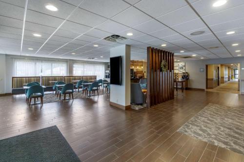 a lobby with a waiting area with a table and chairs at Best Western Plus Bellingham in Bellingham