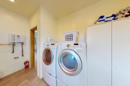a washer and dryer in a laundry room at Cottam Pines A in Taos