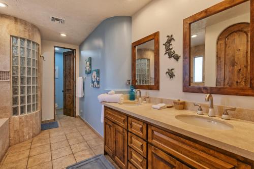 a bathroom with a sink and a mirror at Bella Sirena Luxury Condo 205-B in Puerto Peñasco