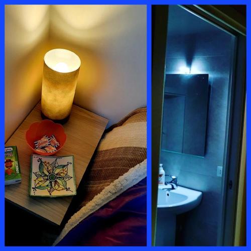 a bedroom with a sink and a bed with a table at SPARTA in Ercolano