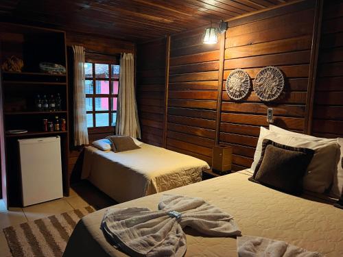 Katil atau katil-katil dalam bilik di Sarandy Hotel Eco Parque