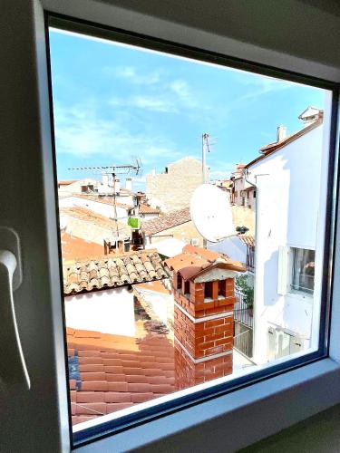 a window with a view of a roof at Loreto LYA SEA VIEW APARTMENTS in Rovinj