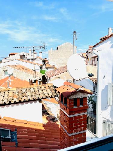 a view of the roofs of buildings with a satellite at Loreto LYA SEA VIEW APARTMENTS in Rovinj