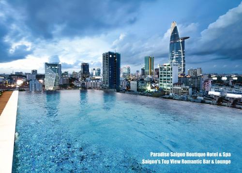 a swimming pool on the roof of a city at Paradise Saigon Boutique Hotel & Spa in Ho Chi Minh City