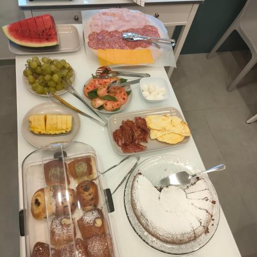 a table filled with different types of food on it at Maison Nanà in Sorrento