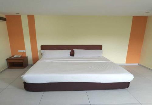 Un ou plusieurs lits dans un hébergement de l'établissement Sun Inns Hotel Cheras - Balakong