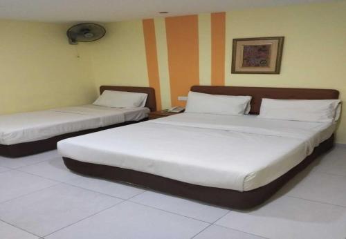 Un ou plusieurs lits dans un hébergement de l'établissement Sun Inns Hotel Cheras - Balakong