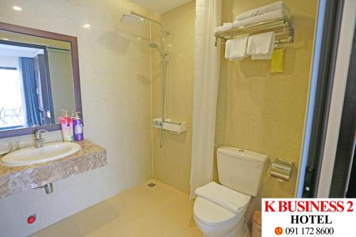 a bathroom with a toilet and a sink and a shower at K Business 2 Hotel My Dinh 미딩 in Hanoi