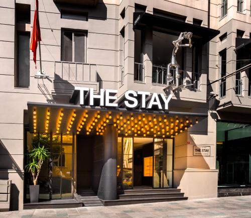 a building with a sign that reads the stay at The Stay Boulevard Nisantasi in Istanbul