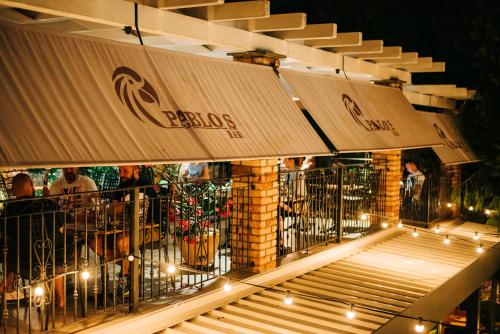 a restaurant with a balcony with lights on it at Sundial Boutique Hotel in Zagreb