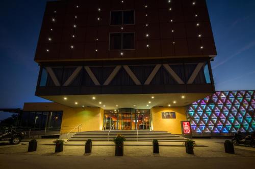 a building with stairs in front of it at night at Safir Hotel Casino in Sežana