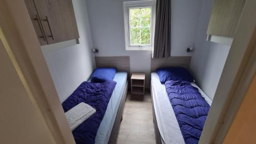 Postel nebo postele na pokoji v ubytování Strand49 Glamping Sint Maartenszee