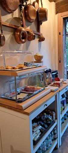 a counter in a kitchen with some food on it at Trout Lodge in Collagna