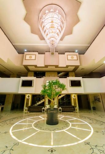 a tree in the center of a room with a ceiling at CONNECT THERMAL HOTEL in Ankara