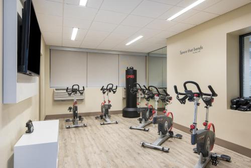 a gym with treadmills and exercise bikes in a room at EVEN Hotel Norwalk by IHG in Norwalk