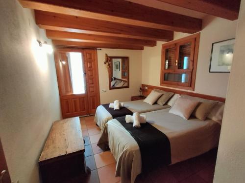 a bedroom with two beds in a room at EL CAJIGAR ORDESA 6-8 pax in Laspuña