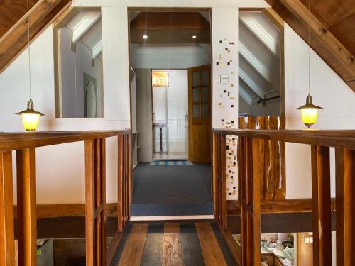 a hallway in a building with wooden beams at Mouggae Blues Villas in Beau Vallon