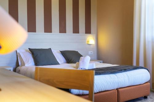 Ένα ή περισσότερα κρεβάτια σε δωμάτιο στο Hotel Castello