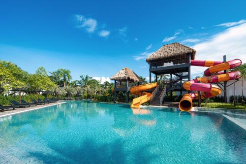 a water slide in a swimming pool at a resort at The Splash Koh Chang in Ko Chang