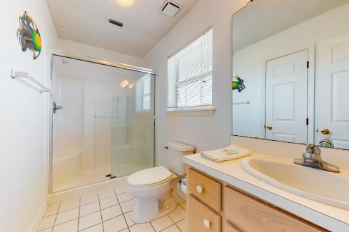 a bathroom with a shower and a toilet and a sink at Dream Chaser in St. George Island
