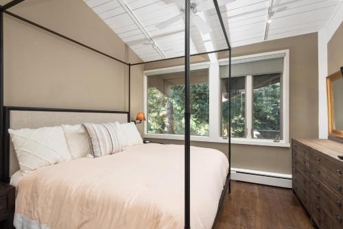 a bedroom with a large bed and a window at Standard 2 Bedroom - Aspen Alps #110 in Aspen