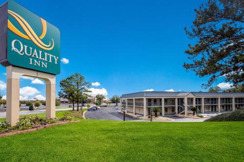 a sign for a quality inn in front of a building at Quality Inn Albany in Albany