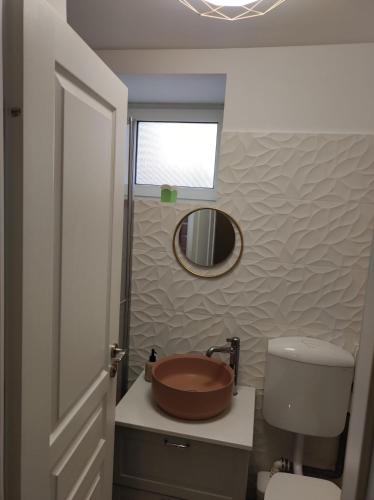 a bathroom with a sink and a toilet and a mirror at Scandinavian Home in Bucharest City Center in Bucharest