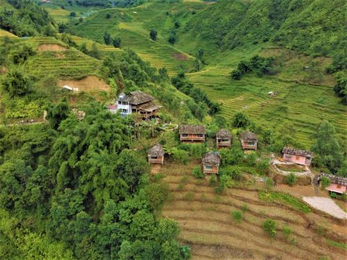 an aerial view of a village on a mountain at Chapa Farmstay - Mountain Retreat in Sa Pa