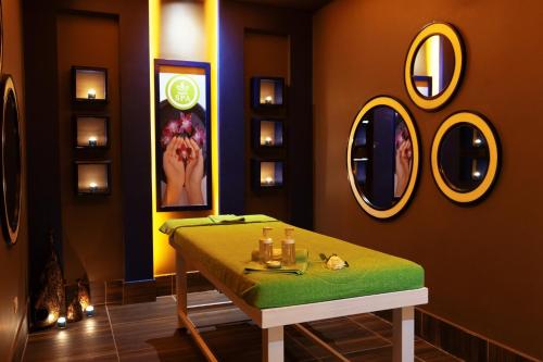 a dressing room with a table and mirrors at Pickalbatros Blu Spa Resort - Adults Friendly 16 Years Plus- Ultra All-Inclusive in Hurghada