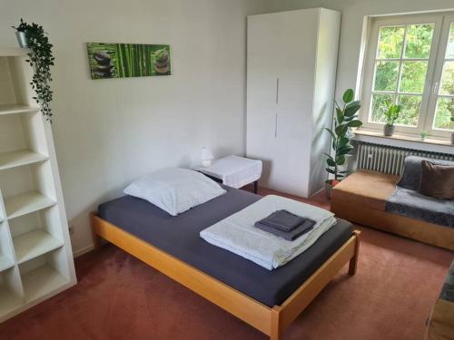 Postel nebo postele na pokoji v ubytování Grüne Wohlfühloase mit einmaliger Aussicht