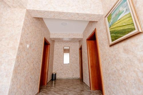 a hallway in a building with a painting on the wall at Piva lake in Plužine