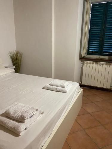 Postel nebo postele na pokoji v ubytování Affittacamere “ La casa di Claretta”