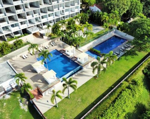 La alberca dentro o cerca de PH El Palmar Residences 2203