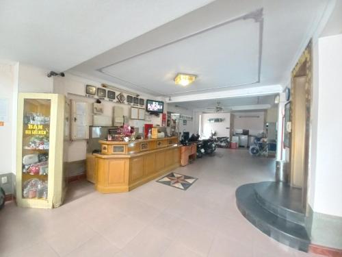 a large room with a counter in a room at Nhật An Hotel in Ho Chi Minh City