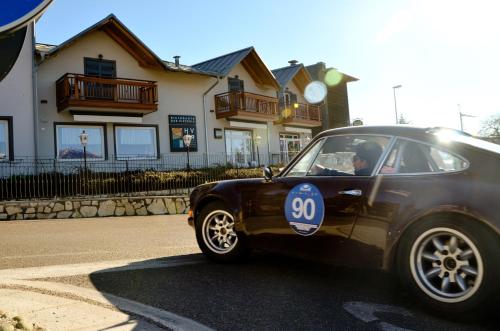 a small black car driving down a street at Hotel Villa Argentina Ronzone in Ronzone