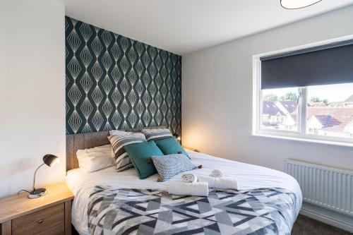 a bedroom with a large bed and a window at Contractor*Leisure*King Bed*Free Parking in Hull