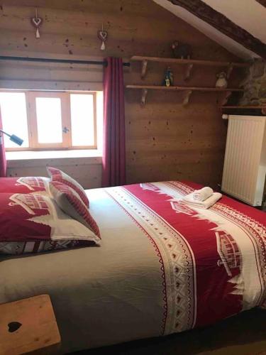 a bedroom with a large bed in a room at Chalet 1728 - La Reculaz - 2 minutes from Val D'isere by free shuttle bus in Tignes