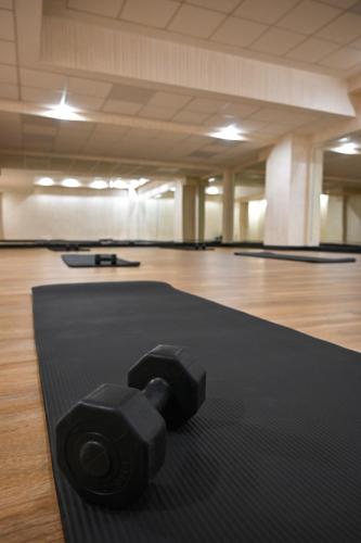 a black mat on the floor of a gym at Aleksandar Palace Hotel Congress Center & SPA in Skopje